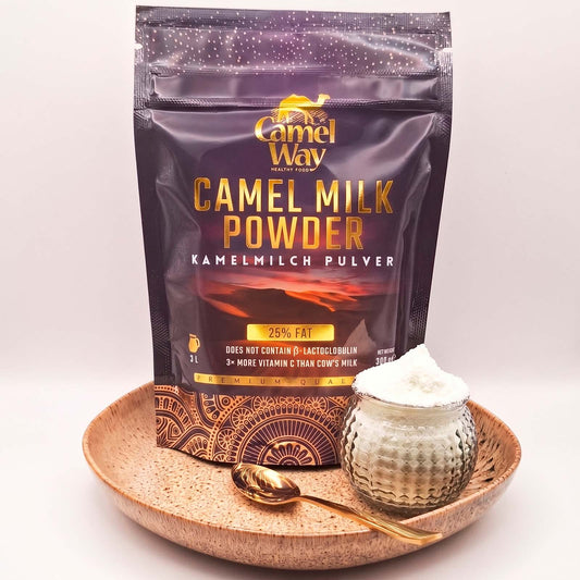 Bag of Camel Way camel milk powder with a bowl of powder on a white background.