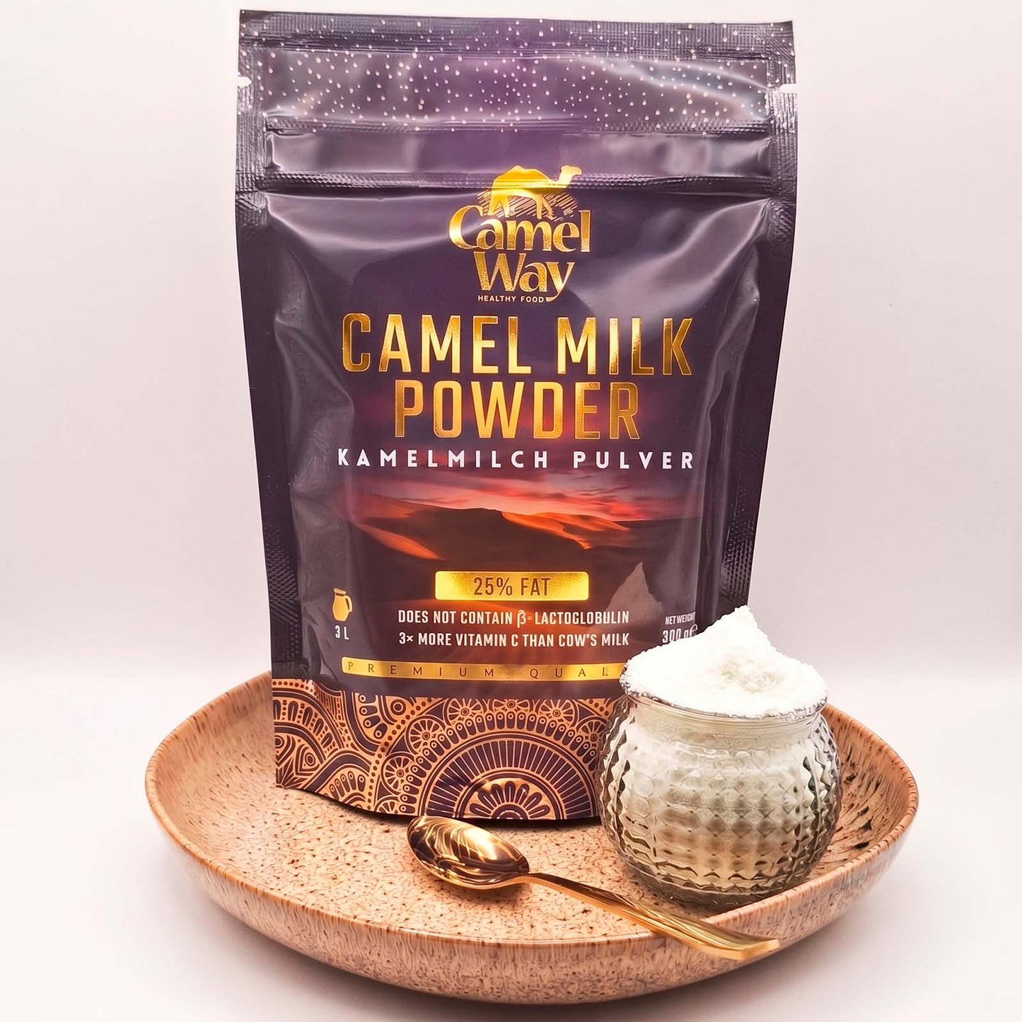 Bag of Camel Way camel milk powder with a bowl of powder on a white background.